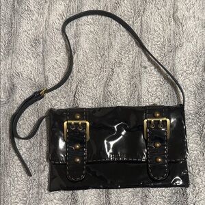 Glossy Black Crossbody Bag with Buckle Accents